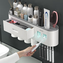 Load image into Gallery viewer, Magnetic Adsorption Inverted Toothbrush Holder Double Automatic Toothpaste Squeezer Dispenser Storage Rack Bathroom Accessories
